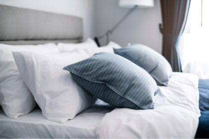 Beautifully made hotel bed with pillows