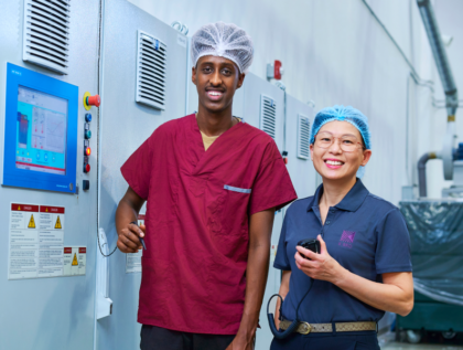 Two K-Bro employees in front of equipment